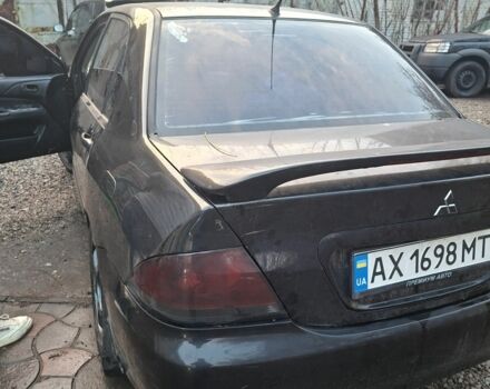 Чорний Міцубісі Lancer, об'ємом двигуна 1.6 л та пробігом 290 тис. км за 3800 $, фото 1 на Automoto.ua