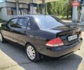 Черный Мицубиси Лансер, объемом двигателя 1.58 л и пробегом 352 тыс. км за 4000 $, фото 2 на Automoto.ua
