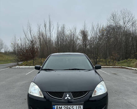 Черный Мицубиси Лансер, объемом двигателя 1.6 л и пробегом 200 тыс. км за 3499 $, фото 6 на Automoto.ua