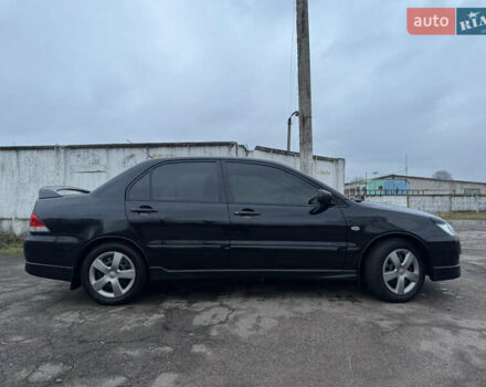 Черный Мицубиси Лансер, объемом двигателя 1.58 л и пробегом 154 тыс. км за 5500 $, фото 7 на Automoto.ua