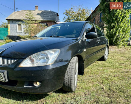 Черный Мицубиси Лансер, объемом двигателя 1.6 л и пробегом 264 тыс. км за 3900 $, фото 10 на Automoto.ua
