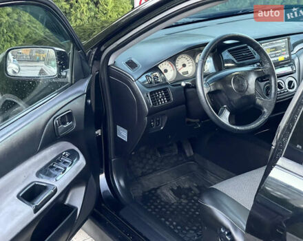 Мицубиси Лансер 2005 в Черкассах на Automoto.ua Черный Мицубиси Лансер, объемом двигателя 1.58 л и пробегом 368 тыс. км за 4400 $, фото 23 на Automoto.ua