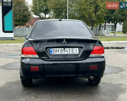 Черный Мицубиси Лансер, объемом двигателя 1.58 л и пробегом 300 тыс. км за 3850 $, фото 5 на Automoto.ua