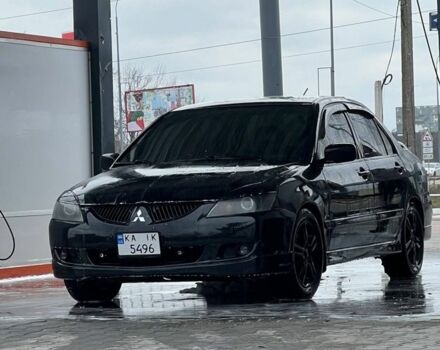 Черный Мицубиси Лансер, объемом двигателя 2 л и пробегом 352 тыс. км за 4100 $, фото 5 на Automoto.ua