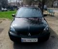 Чорний Міцубісі Lancer, об'ємом двигуна 2 л та пробігом 265 тис. км за 4000 $, фото 1 на Automoto.ua