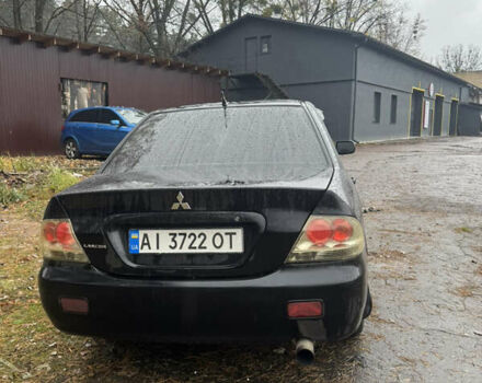 Черный Мицубиси Лансер, объемом двигателя 1.58 л и пробегом 264 тыс. км за 4600 $, фото 6 на Automoto.ua