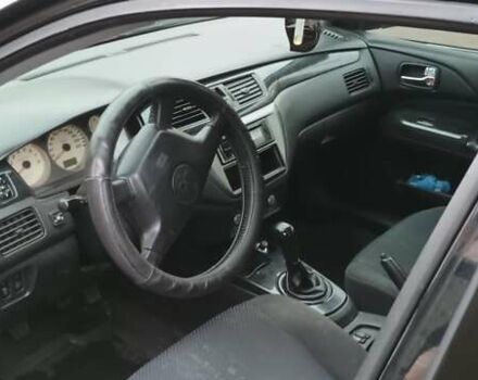 Черный Мицубиси Лансер, объемом двигателя 1.58 л и пробегом 261 тыс. км за 4400 $, фото 1 на Automoto.ua