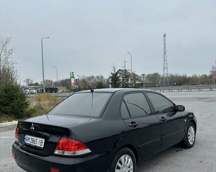 Черный Мицубиси Лансер, объемом двигателя 1.6 л и пробегом 200 тыс. км за 3499 $, фото 1 на Automoto.ua
