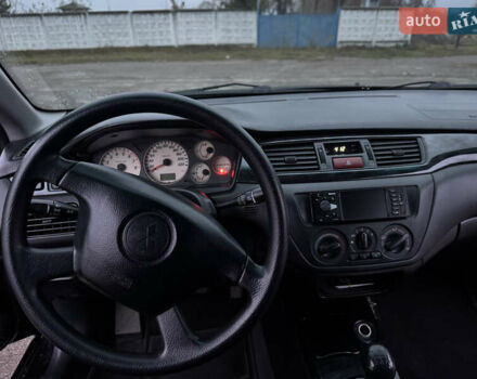 Черный Мицубиси Лансер, объемом двигателя 1.58 л и пробегом 154 тыс. км за 5500 $, фото 28 на Automoto.ua