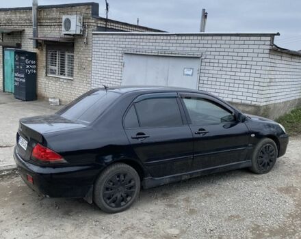 Чорний Міцубісі Lancer, об'ємом двигуна 1.6 л та пробігом 250 тис. км за 3500 $, фото 4 на Automoto.ua