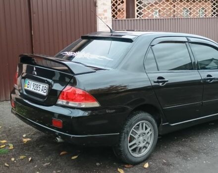 Чорний Міцубісі Lancer, об'ємом двигуна 1.6 л та пробігом 261 тис. км за 4400 $, фото 3 на Automoto.ua