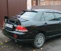 Чорний Міцубісі Lancer, об'ємом двигуна 1.6 л та пробігом 261 тис. км за 4400 $, фото 3 на Automoto.ua