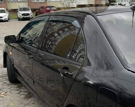 Черный Мицубиси Лансер, объемом двигателя 1.6 л и пробегом 200 тыс. км за 3000 $, фото 3 на Automoto.ua