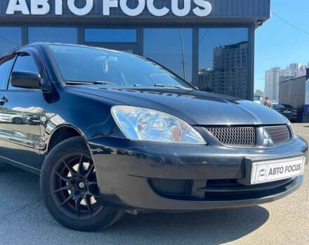 Чорний Міцубісі Lancer, об'ємом двигуна 2 л та пробігом 310 тис. км за 4990 $, фото 1 на Automoto.ua