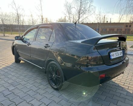 Чорний Міцубісі Lancer, об'ємом двигуна 2 л та пробігом 261 тис. км за 2700 $, фото 12 на Automoto.ua
