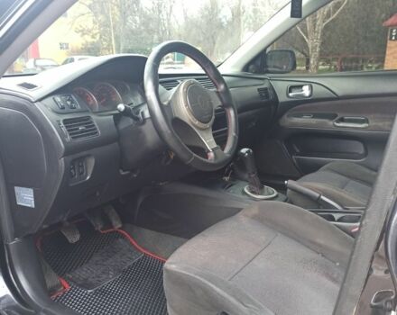 Чорний Міцубісі Lancer, об'ємом двигуна 2 л та пробігом 267 тис. км за 5200 $, фото 3 на Automoto.ua