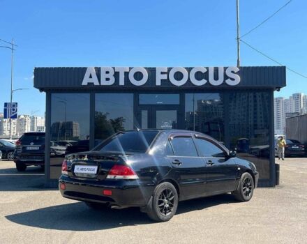 Чорний Міцубісі Lancer, об'ємом двигуна 2 л та пробігом 310 тис. км за 4990 $, фото 7 на Automoto.ua