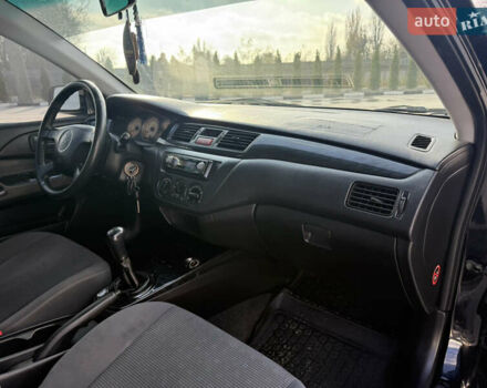 Чорний Міцубісі Lancer, об'ємом двигуна 1.6 л та пробігом 205 тис. км за 3650 $, фото 16 на Automoto.ua