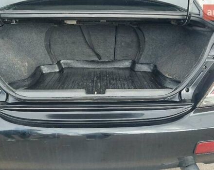 Черный Мицубиси Лансер, объемом двигателя 2 л и пробегом 225 тыс. км за 4400 $, фото 6 на Automoto.ua