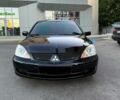 Чорний Міцубісі Lancer, об'ємом двигуна 1.6 л та пробігом 195 тис. км за 3999 $, фото 1 на Automoto.ua