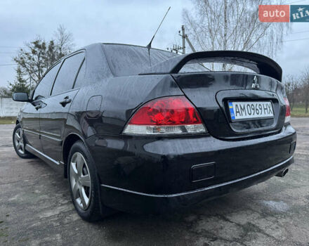 Черный Мицубиси Лансер, объемом двигателя 1.58 л и пробегом 154 тыс. км за 5500 $, фото 13 на Automoto.ua