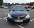 Черный Мицубиси Лансер, объемом двигателя 1.6 л и пробегом 240 тыс. км за 4100 $, фото 1 на Automoto.ua