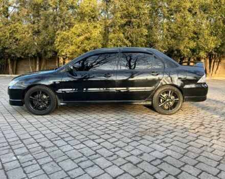 Черный Мицубиси Лансер, объемом двигателя 2 л и пробегом 352 тыс. км за 4100 $, фото 3 на Automoto.ua