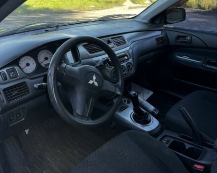Чорний Міцубісі Lancer, об'ємом двигуна 1.6 л та пробігом 1 тис. км за 1750 $, фото 4 на Automoto.ua