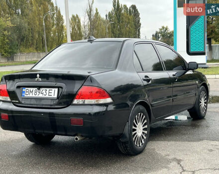 Чорний Міцубісі Lancer, об'ємом двигуна 1.58 л та пробігом 390 тис. км за 4500 $, фото 6 на Automoto.ua