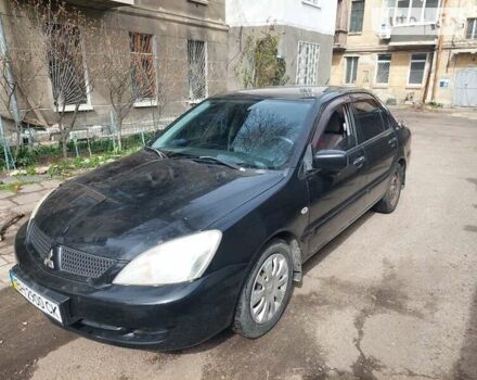 Чорний Міцубісі Lancer, об'ємом двигуна 1.58 л та пробігом 300 тис. км за 4000 $, фото 7 на Automoto.ua