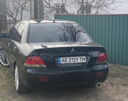 Чорний Міцубісі Lancer, об'ємом двигуна 1.58 л та пробігом 279 тис. км за 4000 $, фото 1 на Automoto.ua
