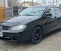 Чорний Міцубісі Lancer, об'ємом двигуна 2 л та пробігом 231 тис. км за 4350 $, фото 1 на Automoto.ua