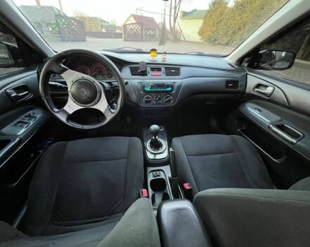 Черный Мицубиси Лансер, объемом двигателя 2 л и пробегом 352 тыс. км за 4100 $, фото 4 на Automoto.ua