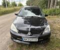 Черный Мицубиси Лансер, объемом двигателя 1.6 л и пробегом 175 тыс. км за 4519 $, фото 1 на Automoto.ua