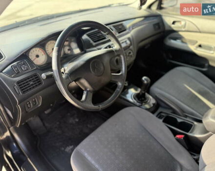 Чорний Міцубісі Lancer, об'ємом двигуна 1.6 л та пробігом 205 тис. км за 3650 $, фото 7 на Automoto.ua
