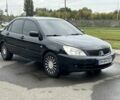 Черный Мицубиси Лансер, объемом двигателя 1.6 л и пробегом 298 тыс. км за 3800 $, фото 1 на Automoto.ua