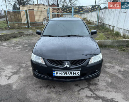 Черный Мицубиси Лансер, объемом двигателя 1.58 л и пробегом 154 тыс. км за 5500 $, фото 3 на Automoto.ua