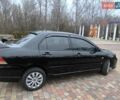 Чорний Міцубісі Lancer, об'ємом двигуна 1.58 л та пробігом 263 тис. км за 4500 $, фото 4 на Automoto.ua