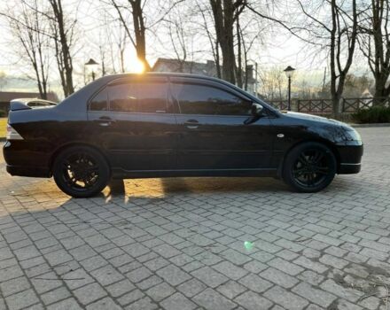 Черный Мицубиси Лансер, объемом двигателя 2 л и пробегом 352 тыс. км за 4100 $, фото 2 на Automoto.ua