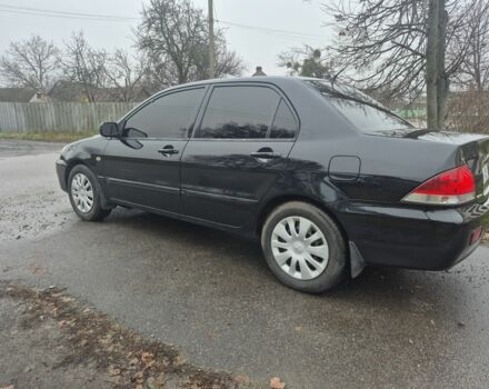 Черный Мицубиси Лансер, объемом двигателя 1.6 л и пробегом 280 тыс. км за 3200 $, фото 2 на Automoto.ua