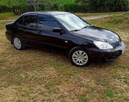 Чорний Міцубісі Lancer, об'ємом двигуна 1.6 л та пробігом 206 тис. км за 3400 $, фото 2 на Automoto.ua
