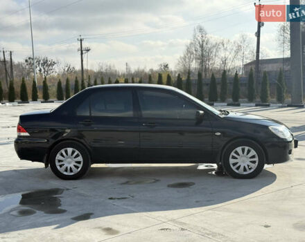 Чорний Міцубісі Lancer, об'ємом двигуна 1.6 л та пробігом 205 тис. км за 3650 $, фото 4 на Automoto.ua