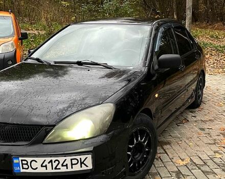 Черный Мицубиси Лансер, объемом двигателя 1.6 л и пробегом 200 тыс. км за 3000 $, фото 2 на Automoto.ua