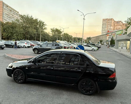 Черный Мицубиси Лансер, объемом двигателя 1.58 л и пробегом 192 тыс. км за 4499 $, фото 5 на Automoto.ua