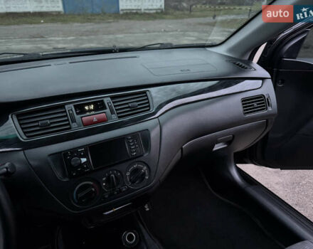 Черный Мицубиси Лансер, объемом двигателя 1.58 л и пробегом 154 тыс. км за 5500 $, фото 30 на Automoto.ua