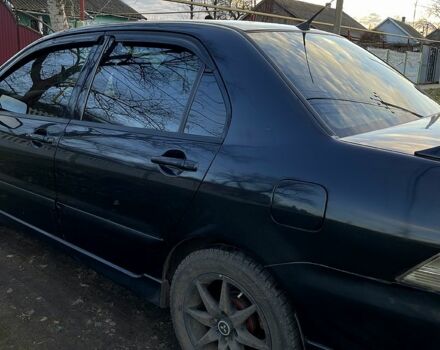 Чорний Міцубісі Lancer, об'ємом двигуна 2 л та пробігом 485 тис. км за 4500 $, фото 8 на Automoto.ua