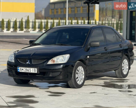 Чорний Міцубісі Lancer, об'ємом двигуна 1.6 л та пробігом 205 тис. км за 3650 $, фото 6 на Automoto.ua