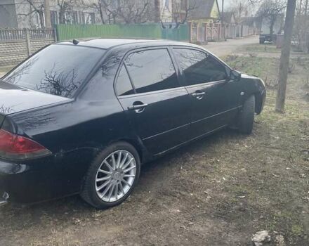 Чорний Міцубісі Lancer, об'ємом двигуна 1.58 л та пробігом 279 тис. км за 4000 $, фото 2 на Automoto.ua