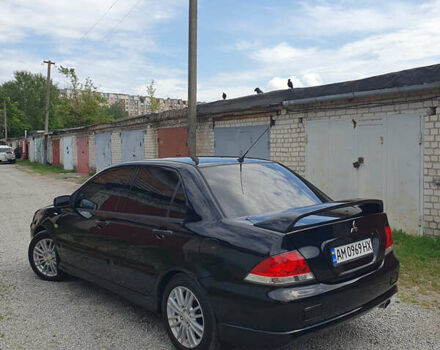 Черный Мицубиси Лансер, объемом двигателя 1.58 л и пробегом 154 тыс. км за 5500 $, фото 48 на Automoto.ua