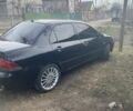 Чорний Міцубісі Lancer, об'ємом двигуна 1.58 л та пробігом 279 тис. км за 4000 $, фото 2 на Automoto.ua